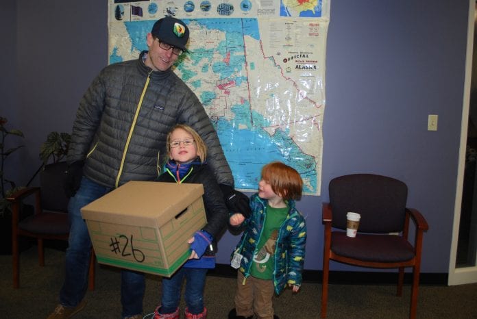 Sam Snyder, engagement director for Trout Unlimited, with his children, Finn, 6, and Deacon, 4, helped deliver boxes of petitions in support of putting the Stand for Salmon petition on the Alaska ballot during a 2018 election. Photo by Margaret Bauman/The Cordova Times