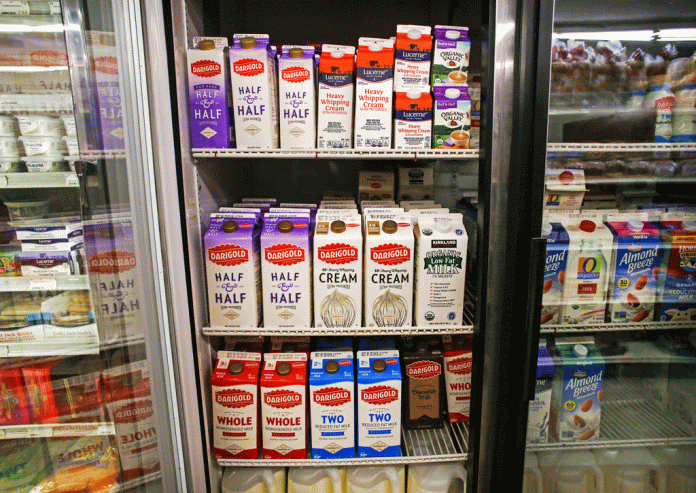 Cartons of Darigold milk sit in the refrigerator at Nichols’ Backdoor Store on Thursday, Jan. 11, 2018. Owner, Dan Nichols, purchases the milk from Sam’s Club. Walmart announced the closing of Sam’s Club branches nationwide, including the three Alaska locations. Photo by Emily Mesner/The Cordova Times