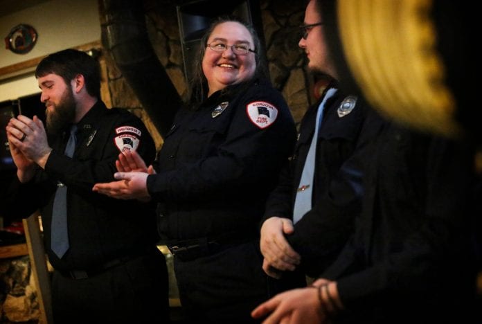 Katherine Mead smiles and laughs with Cody Handley during the CVFD awards banquet held at the Powder House on Saturday, Feb. 10, 2018. Photo by Emily Mesner/The Cordova Times