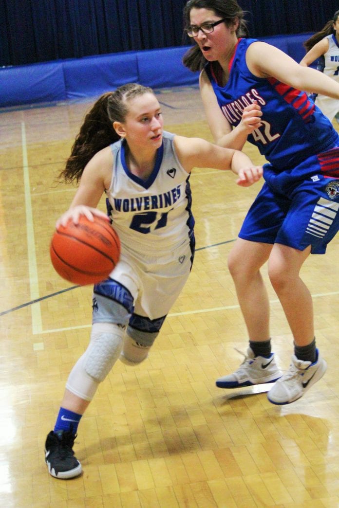 Cordova’s Keyona Mattson drives to the hoop against a Tok defender in Homecoming action on Feb. 16, 2018. Mikie McHone photo/for The Cordova Times