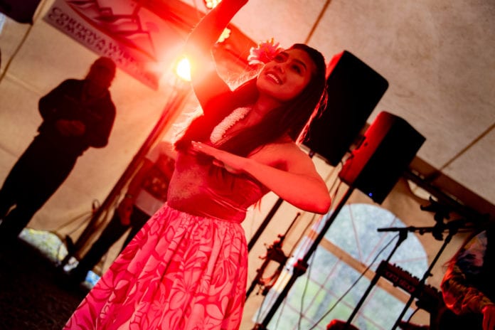 Mahealani MacKenzie performs a traditional hula dance. The Ke Kukui Foundation’s display of Hawaiian music and dance rounded out the second night of Salmon jam on Saturday, July 13, 2019. Photo by Zachary Snowdon Smith/The Cordova Times