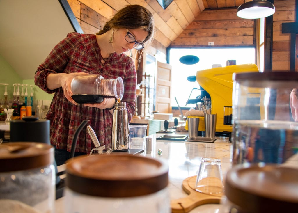 Karen Deaton Perry, co-owner of the Kayak Cafe, prepares a nitro cold-brew coffee. (Sept. 25, 2019) Photo by Zachary Snowdon Smith/The Cordova Times
