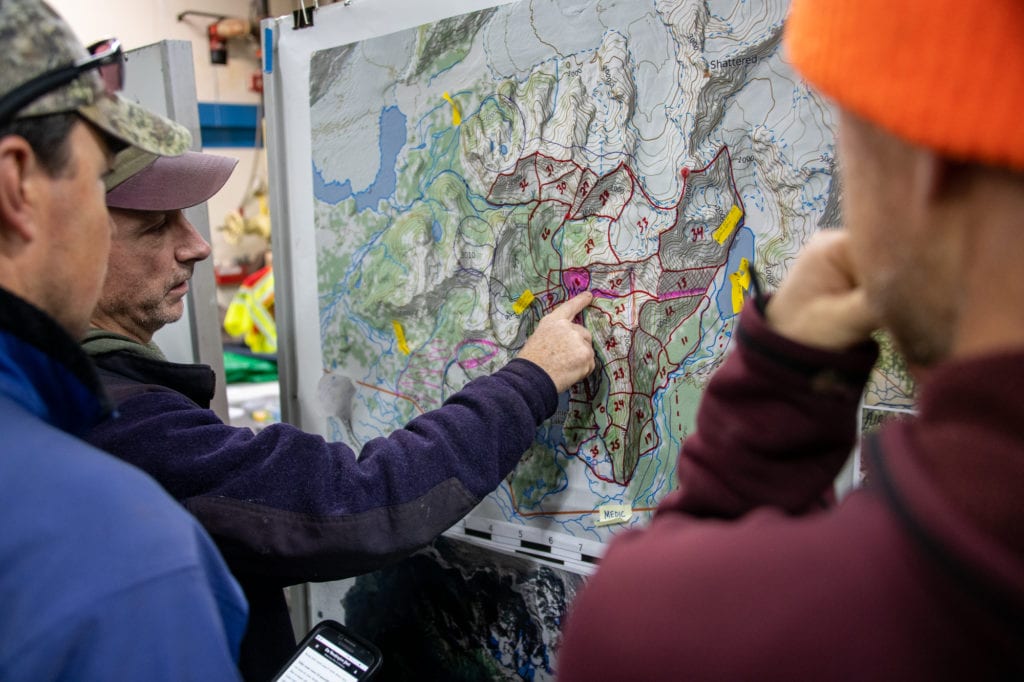 Dana Smyke discusses search operations with other volunteers. (Oct. 13, 2019) Photo by Zachary Snowdon Smith/The Cordova Times