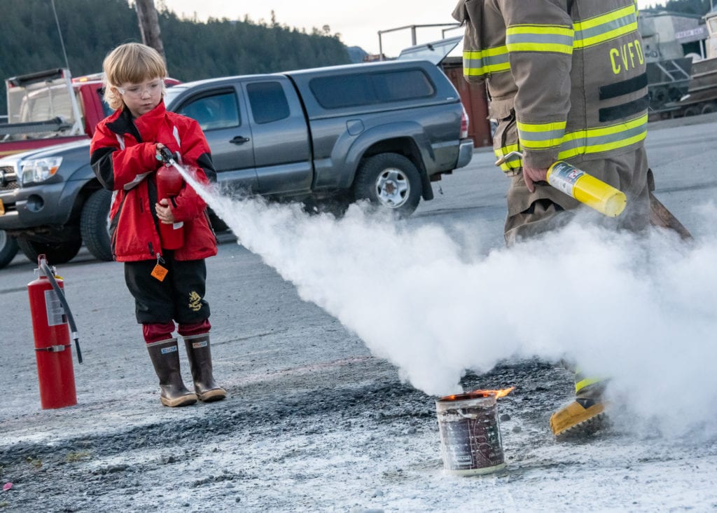 Atticus Phillips, 5, practices using a fire extinguisher. (Oct. 19, 2019) Photo by Zachary Snowdon Smith/The Cordova Times