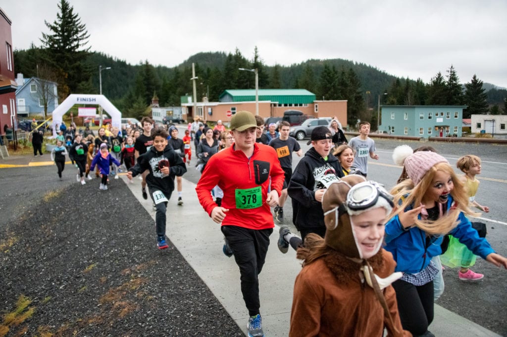 Runners pass the starting line during Cordova Family Resource Center’s Girls on the Run Costume 5K event. (Oct. 26, 2019) Photo by Zachary Snowdon Smith/The Cordova Times