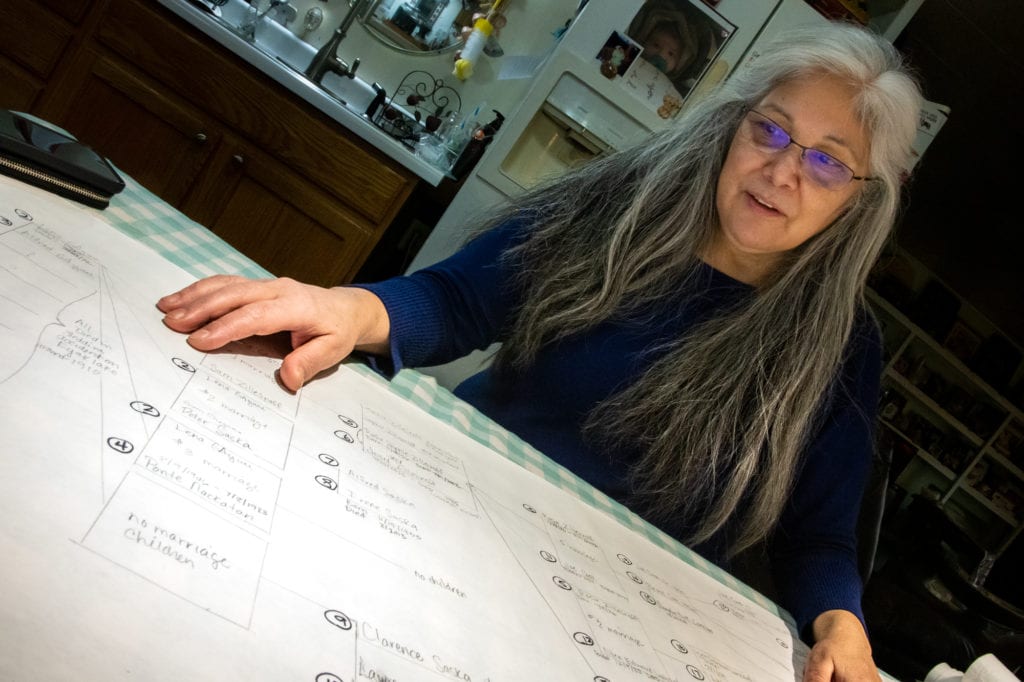 Pam Smith pores over a genealogical chart. (Nov. 6, 2019) Photo by Zachary Snowdon Smith/The Cordova Times
