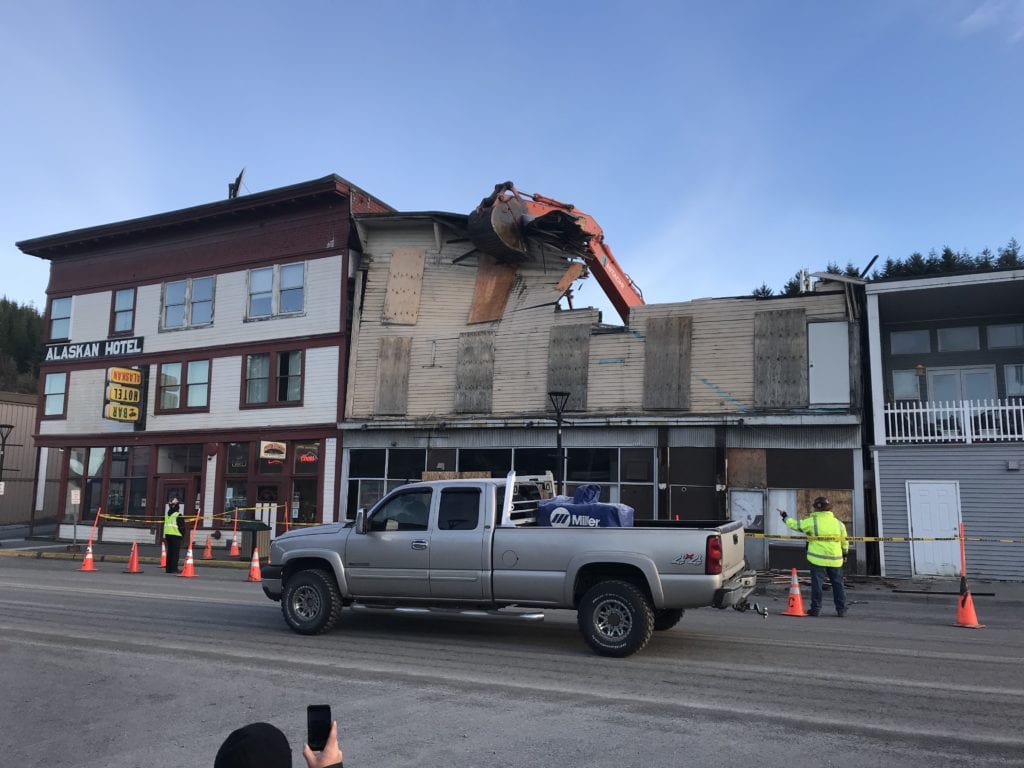 A driver peers out the window of his pickup while passing the demolition of the CoHo on November 11, 2019.   Photo courtesy of Dick Shellhorn