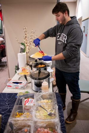 Brent Olsen prepares tacos for hungry shoppers at the Moonlight Madness Food Court event. (Dec. 20, 2019) Photo by Zachary Snowdon Smith